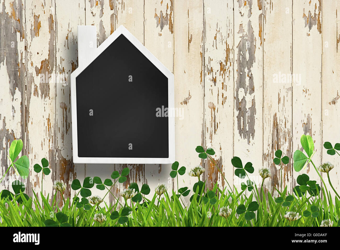 House shaped chalkboard on wooden plank background Stock Photo Alamy