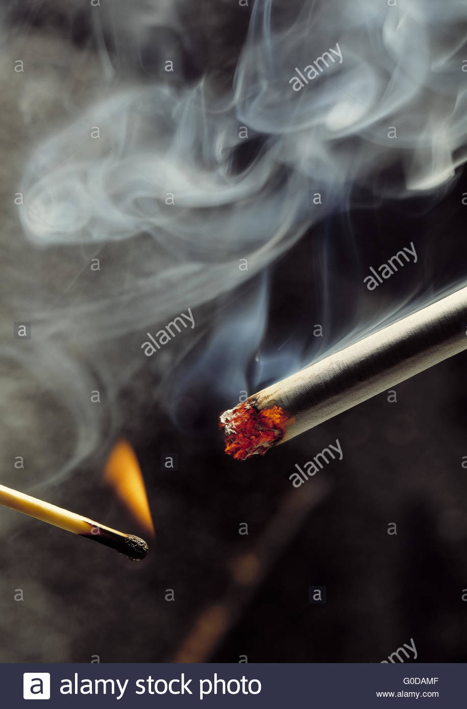 Lighting Cigarette Match Stock Photos & Lighting Cigarette Match Stock