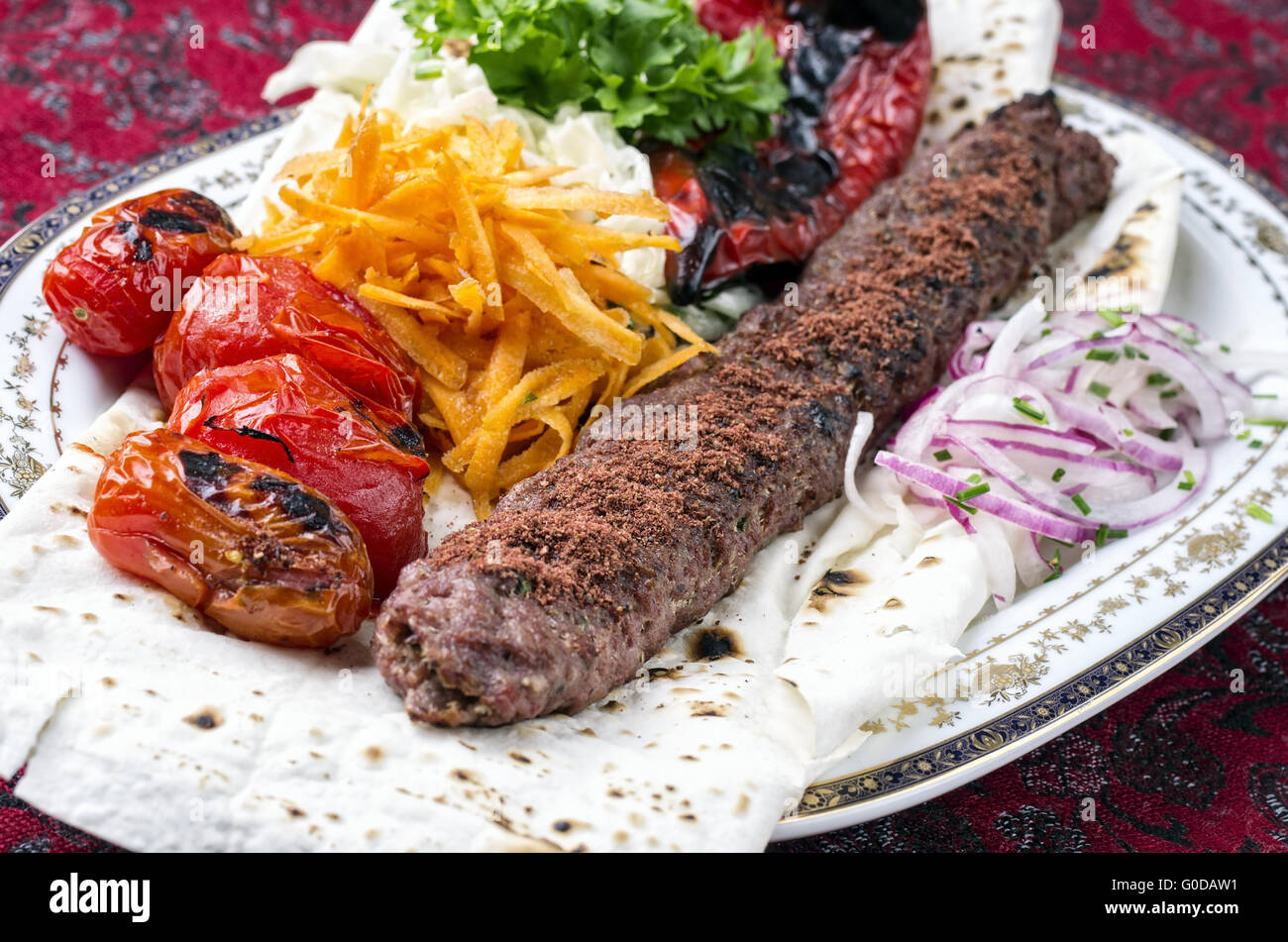 grilled koobideh with vegetables and flat bread Stock Photo