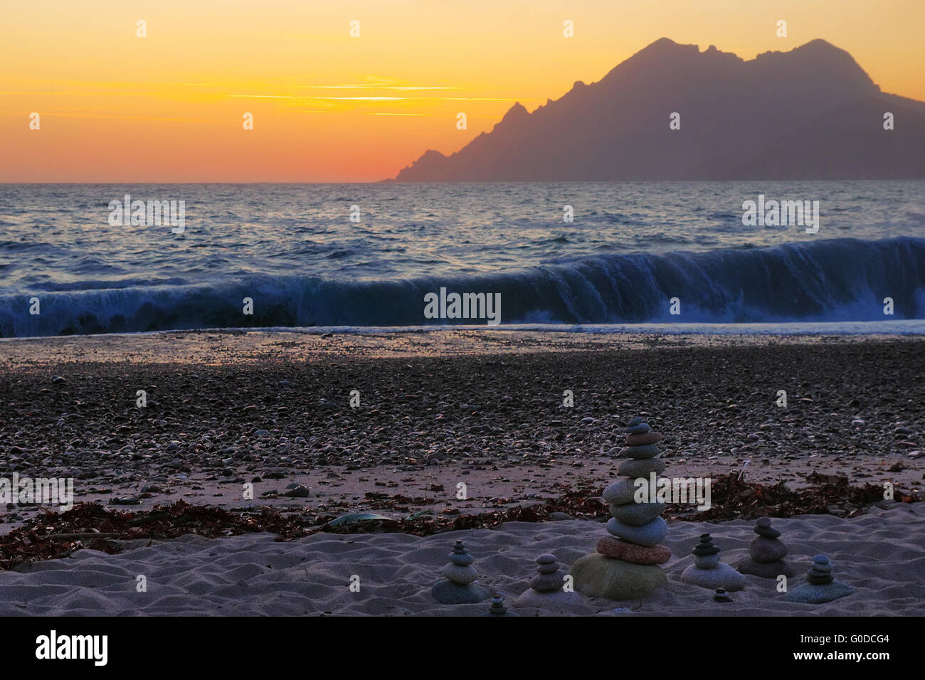 Surging billow in the afterglow at the beach Stock Photo