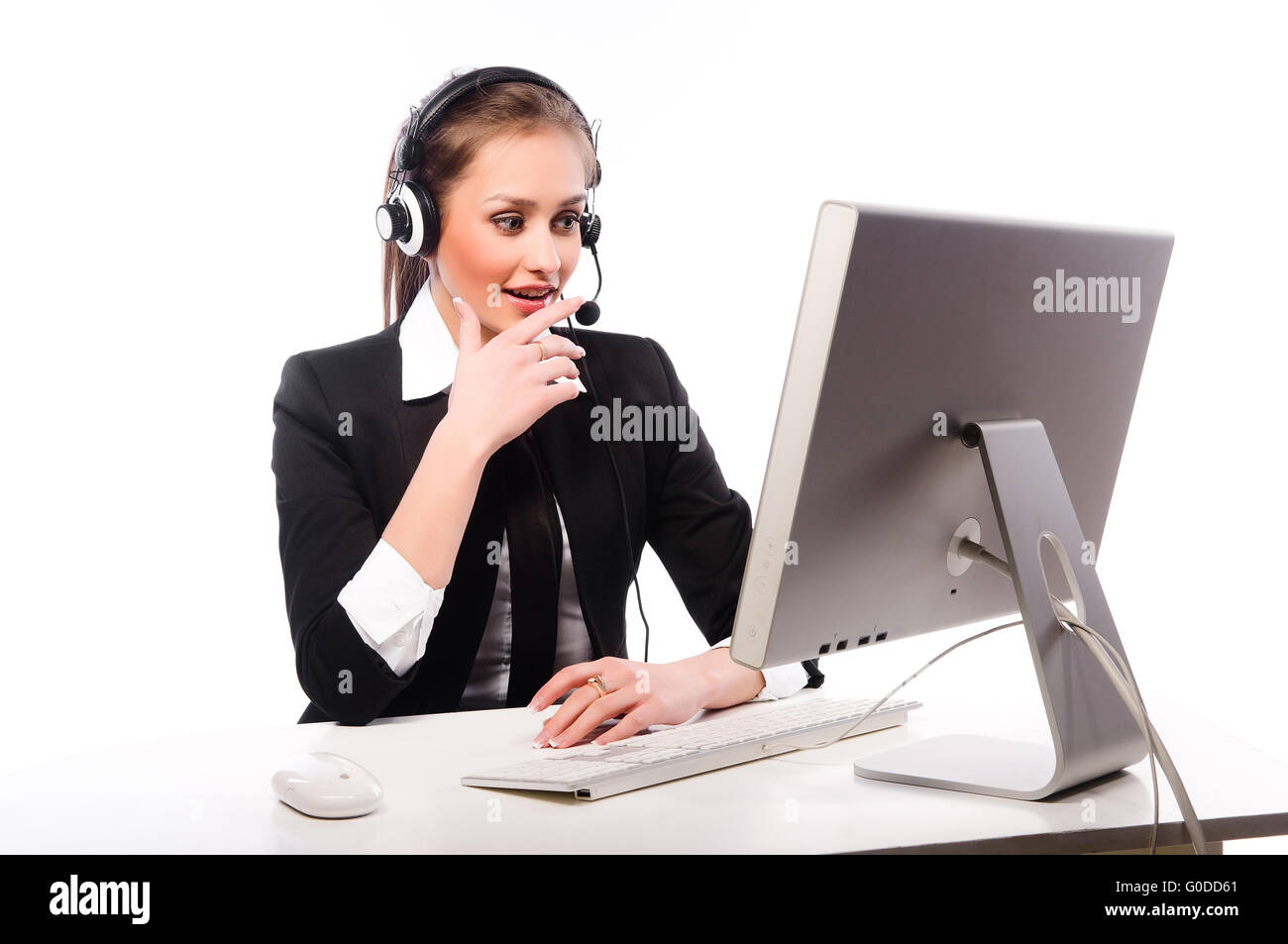 A young woman working at the computer on a white background Stock Photo ...