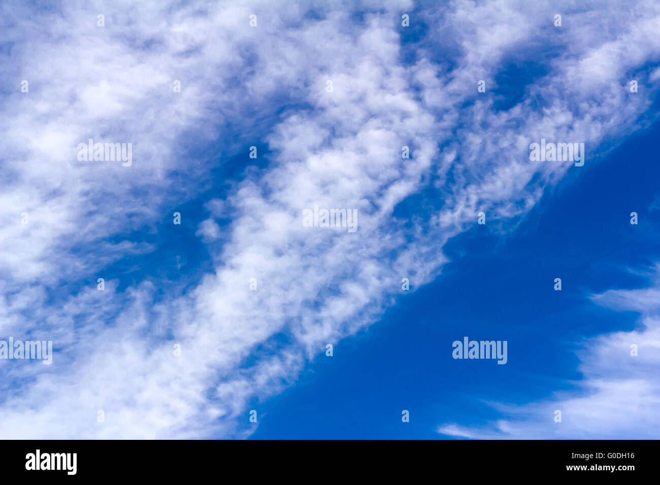 Blue sky and white fluffy clouds Stock Photo - Alamy