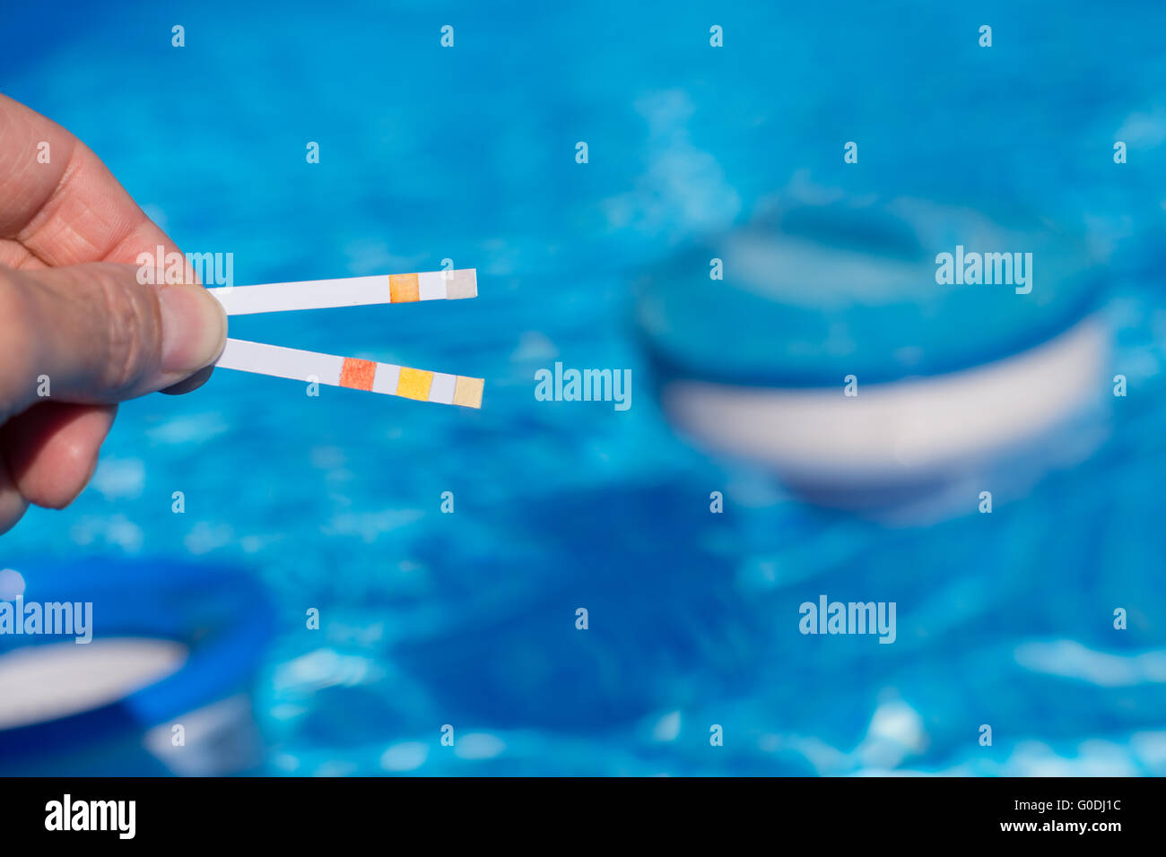 Test strip shows important values in the pool Stock Photo