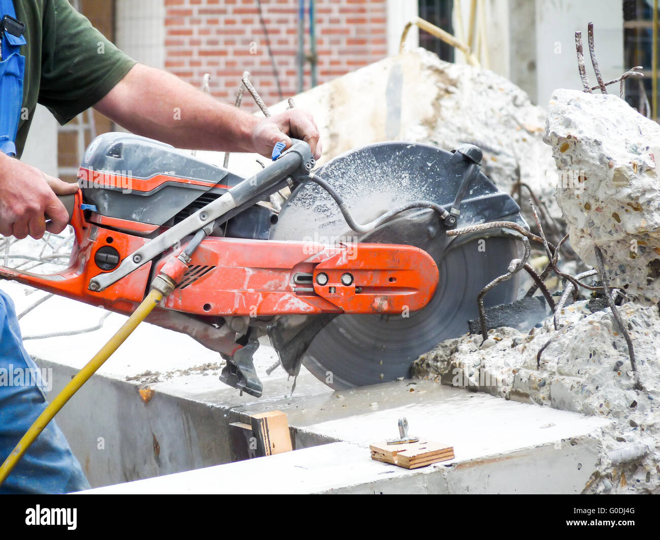 Arms with grinder cutting concrete Stock Photo Alamy