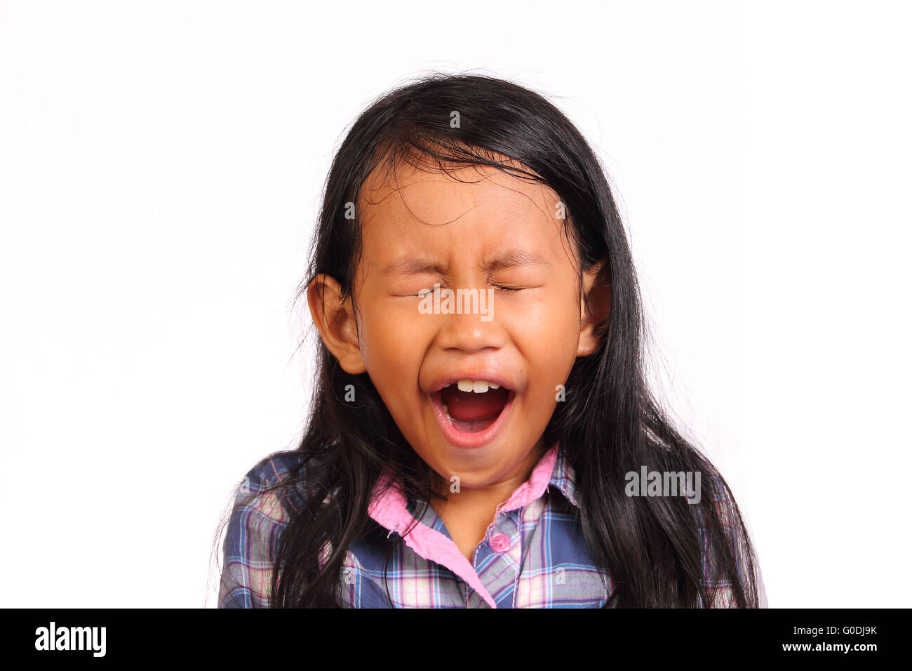 Little girl tired and yawning isolated on white Stock Photo