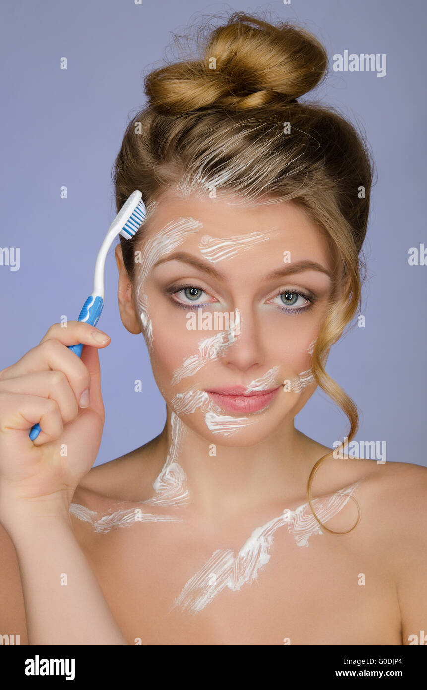 Surprised woman with toothbrush and toothpaste Stock Photo Alamy