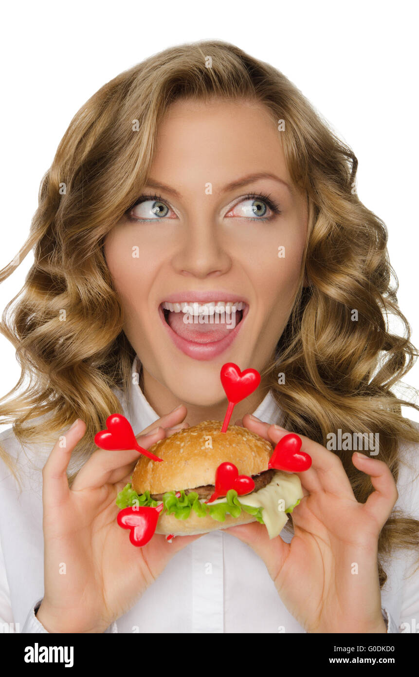 Woman with hamburger from hearts looking away Stock Photo