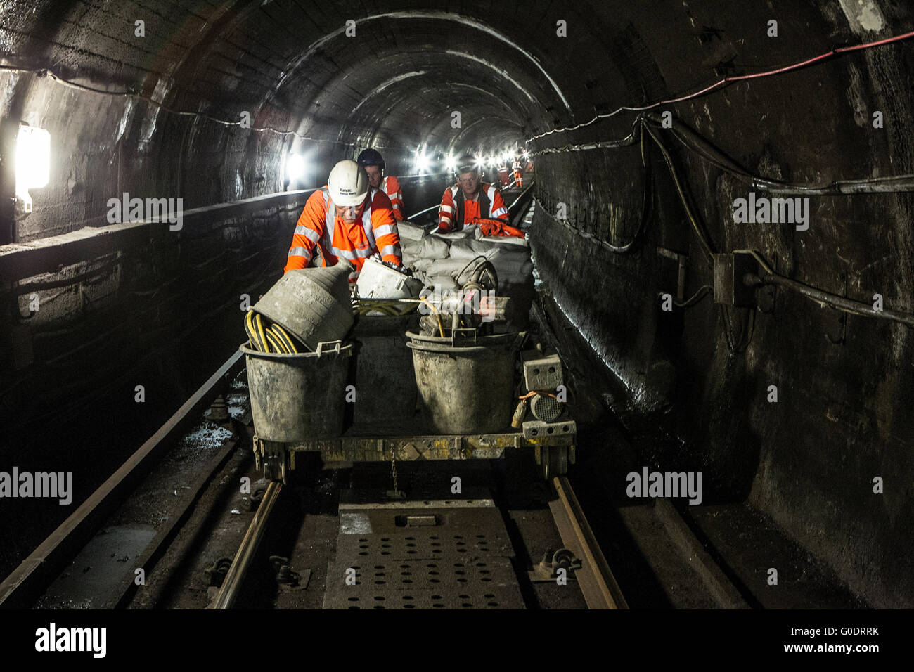 Maintenance workers working on Glasgow Underground Stock Photo Alamy