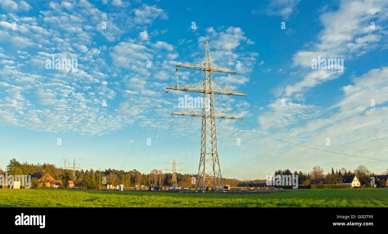 electrical tower on a field Stock Photo