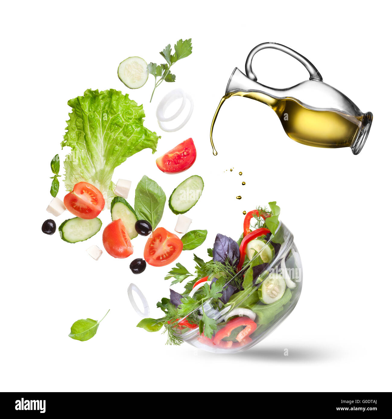 Falling vegetables for salad and oil isolated Stock Photo