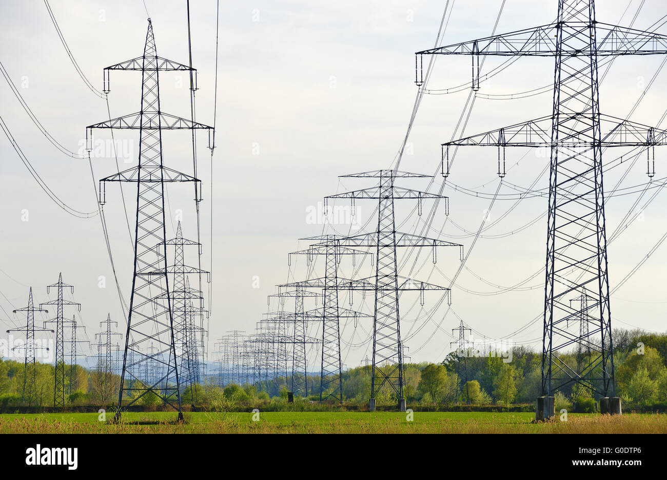 power poles with multiple high-voltage power lines Stock Photo
