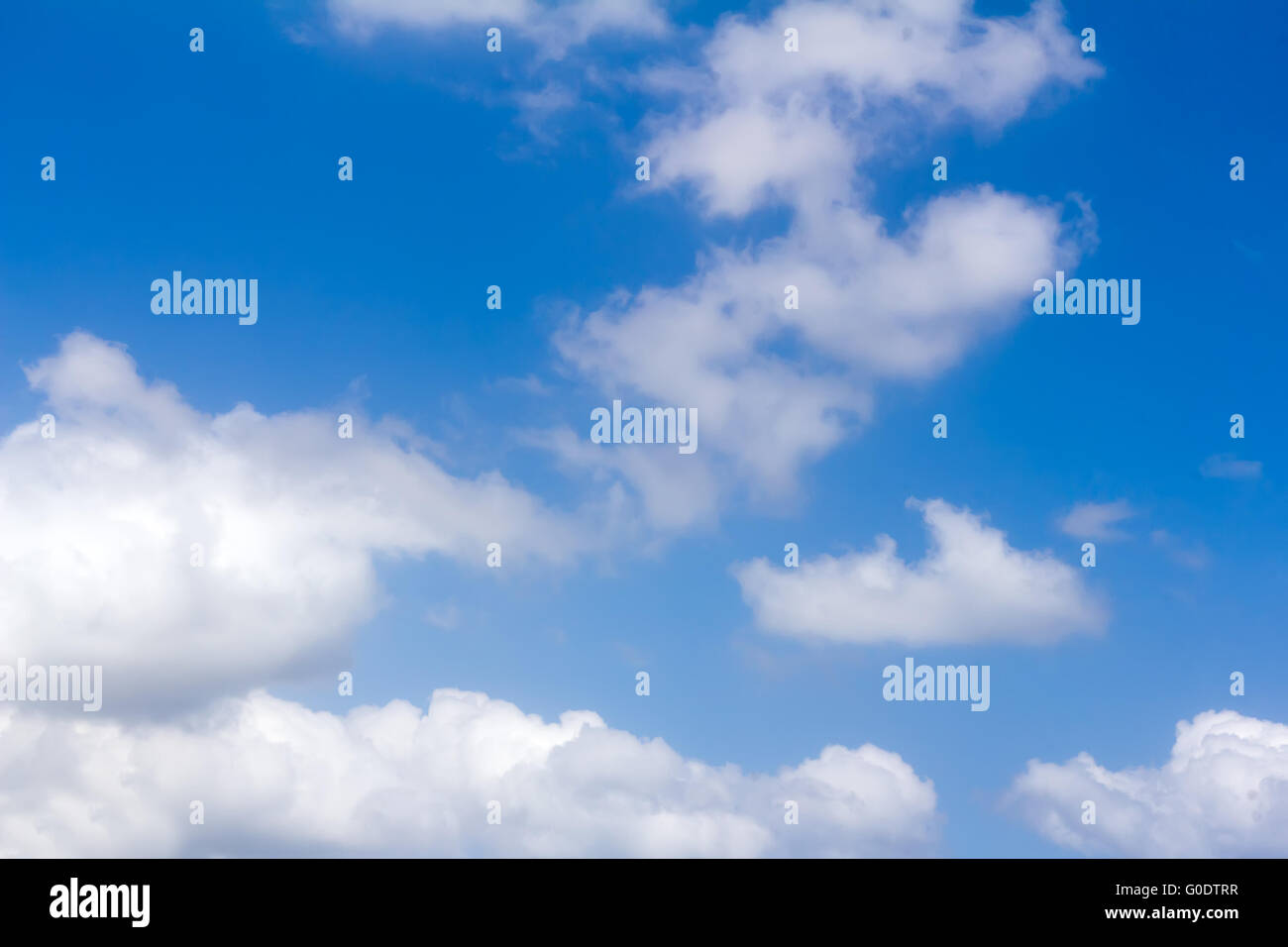 Blue sky and white fluffy clouds Stock Photo - Alamy