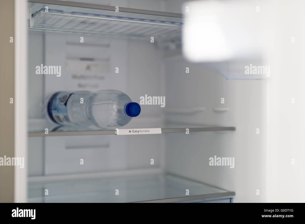 A single bottle of water located in an otherwise Stock Photo