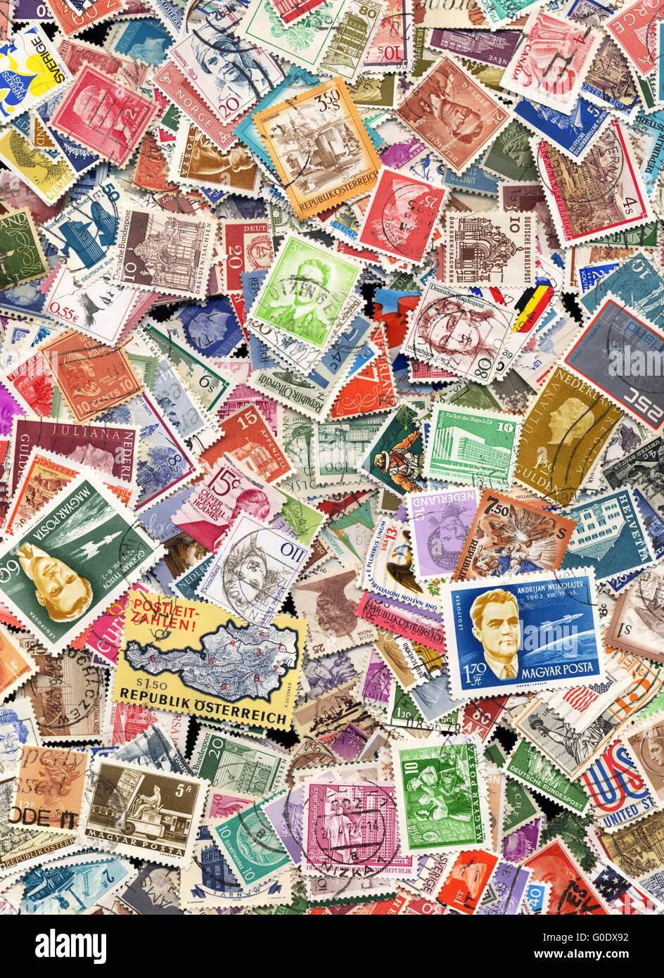 Hundreds of postage stamps from many different countries Stock Photo