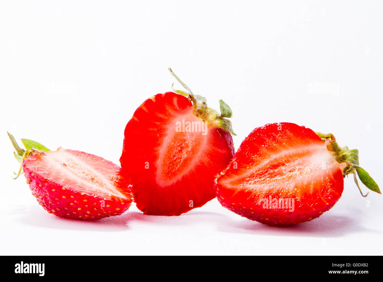 Ripe red strawberries on white background isolated Stock Photo - Alamy