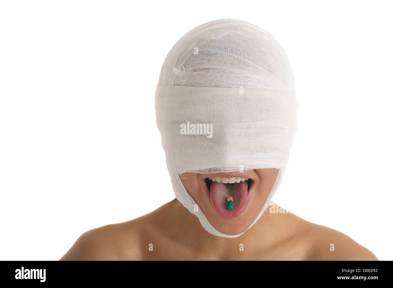 Woman with bandaged head with tablet in tongue Stock Photo