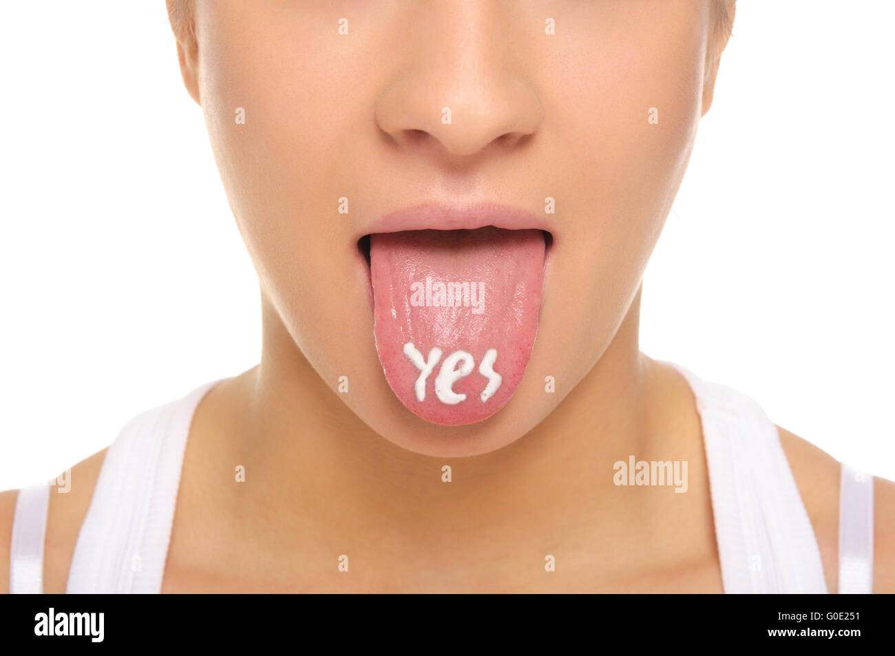 Woman puts out the tongue with an inscription yes Stock Photo