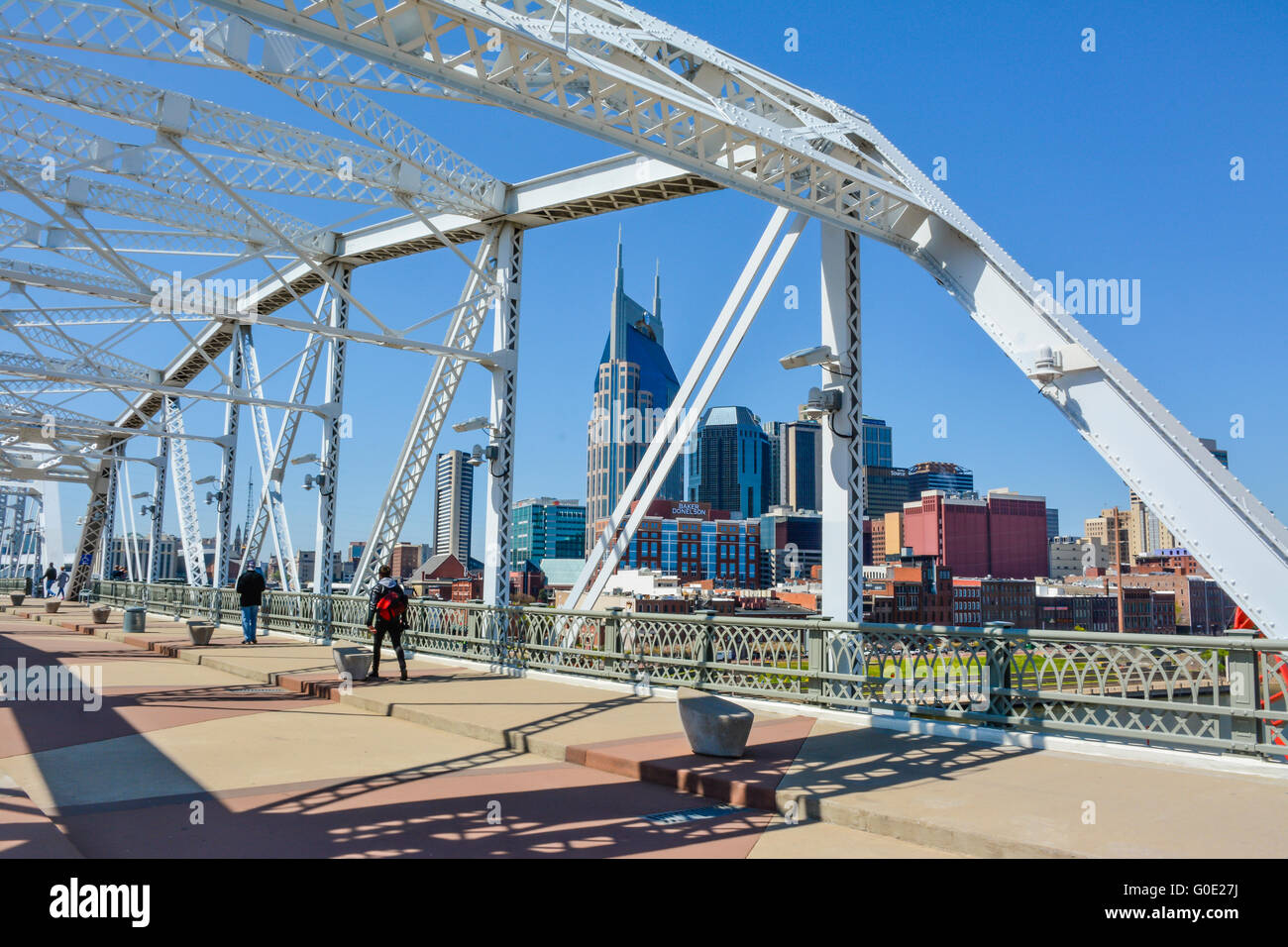 The rehabilitated Shelby Street Pedestrian-only Bridge offers views of downtown Nashville's iconic Skyline in Music City TN USA Stock Photo
