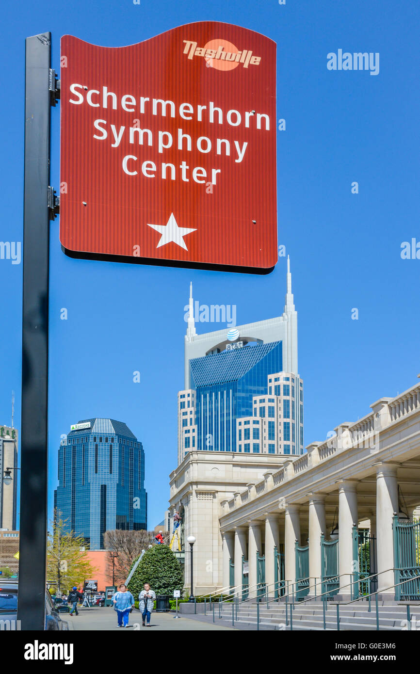 Sign for Schermerhorn Symphony Center entrance with the Nashville TN landmark, the 'Batman' building and downtown in background Stock Photo