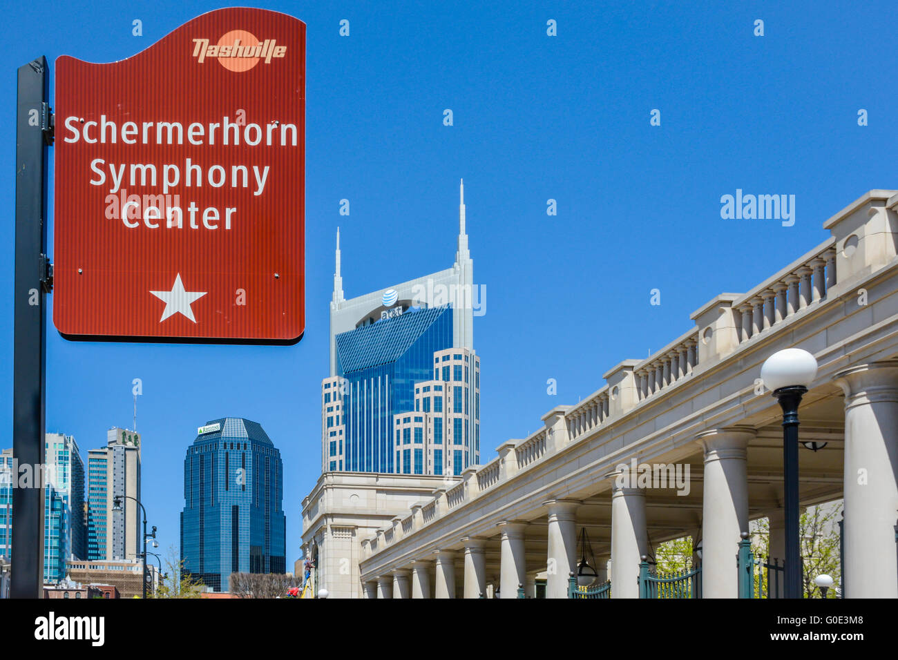Sign for Schermerhorn Symphony Center entrance with the Nashville TN landmark, the 'Batman' building and downtown in background Stock Photo