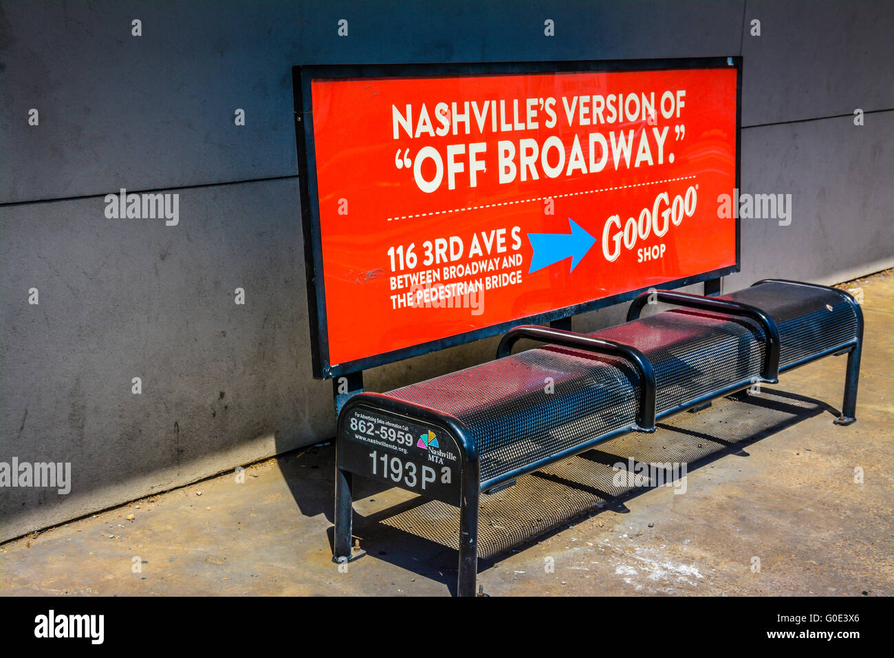 Graphic black and red city bus bench with amusing advertising slogan for Goo Goo candy Shop on 3rd Ave S in Nashville, TN Stock Photo