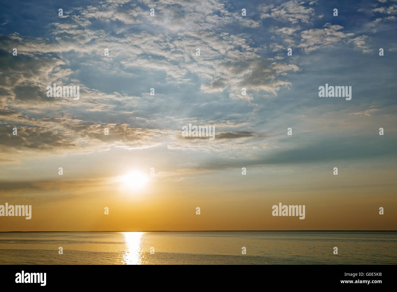 Sunset with sun rays and clouds Stock Photo - Alamy