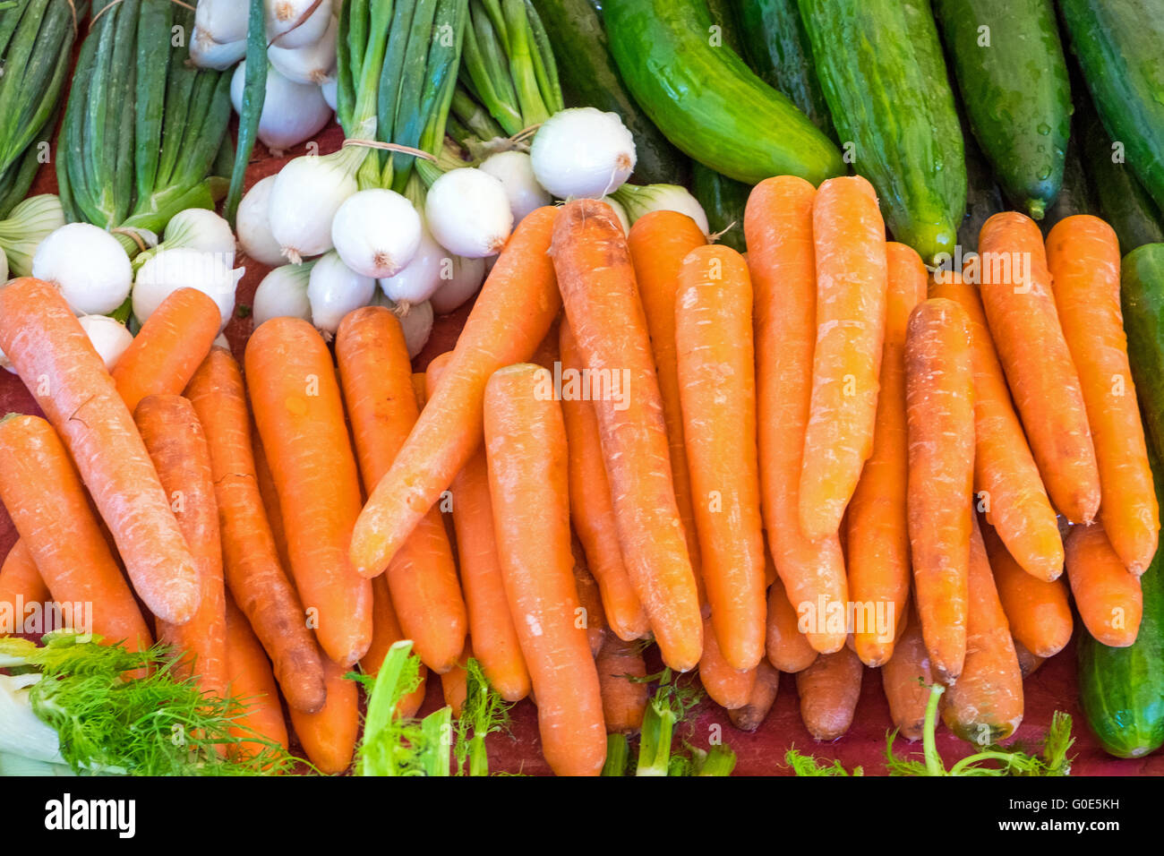 Carrots and cucumber for sale at a market Stock Photo