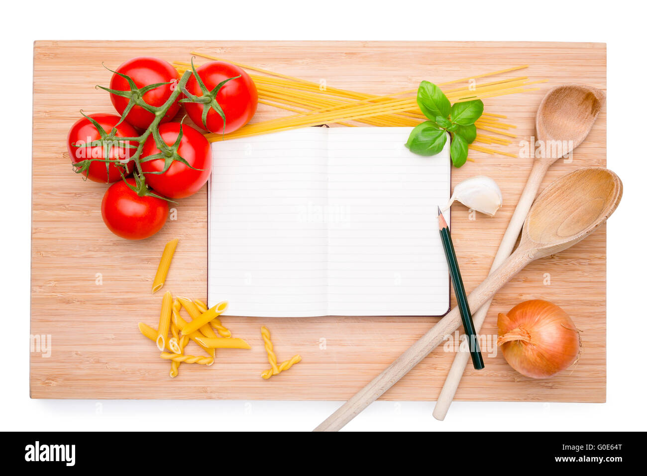 Cookery book arranged on wooden board with differe Stock Photo
