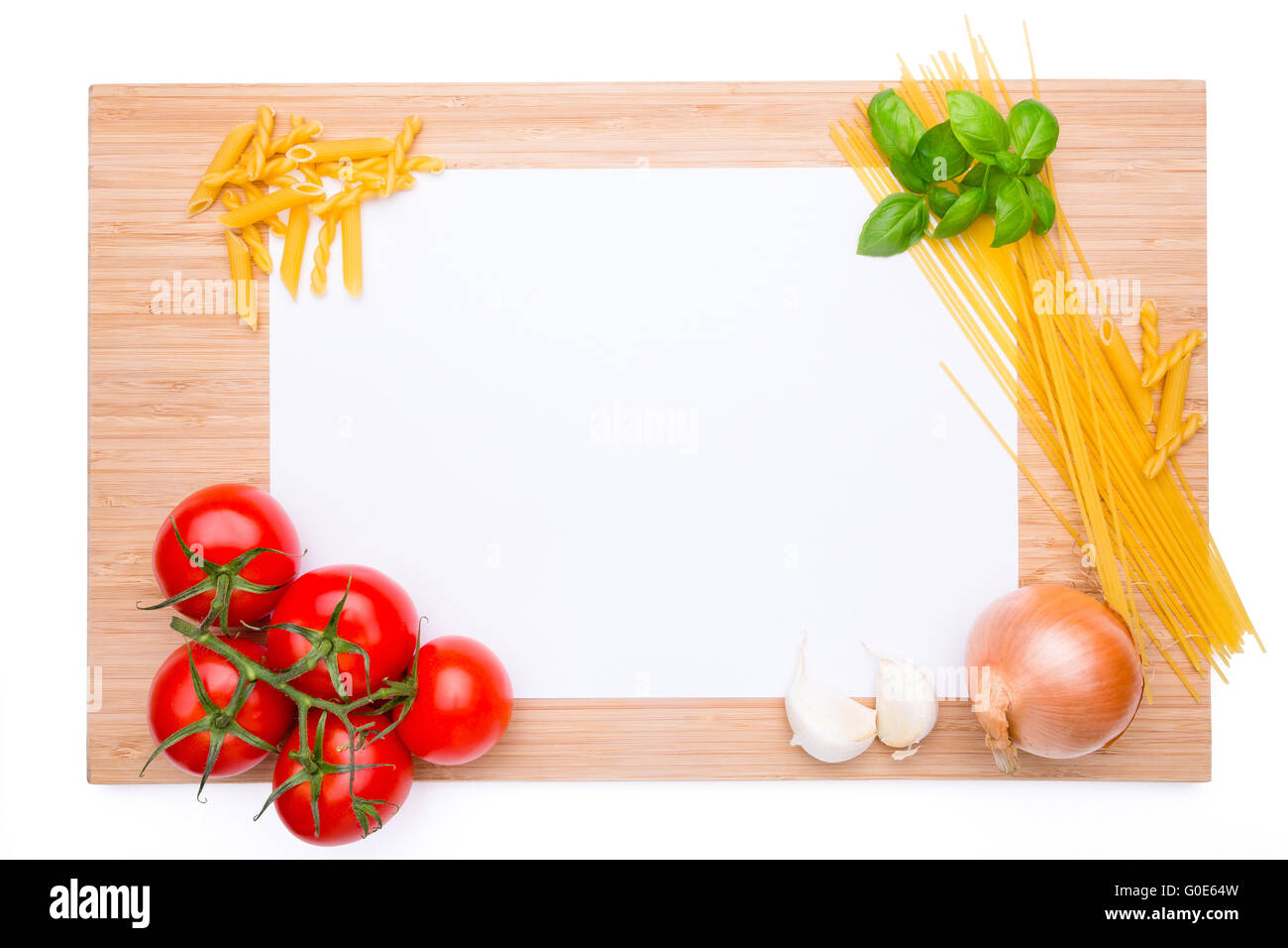 Wooden cutting board with knife and vegetables on Stock Photo