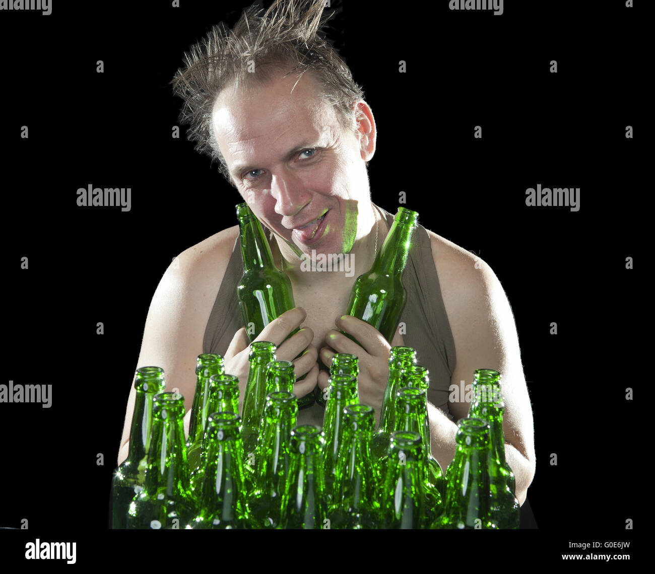 happy tipsy man near empty beer bottles Stock Photo Alamy