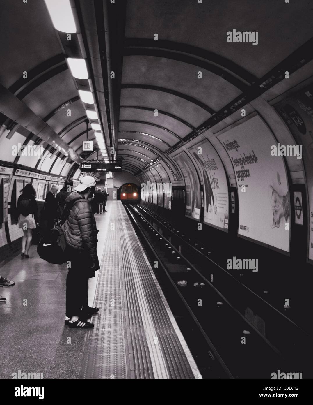 Hyde Park Underground station with black and white effect and a red