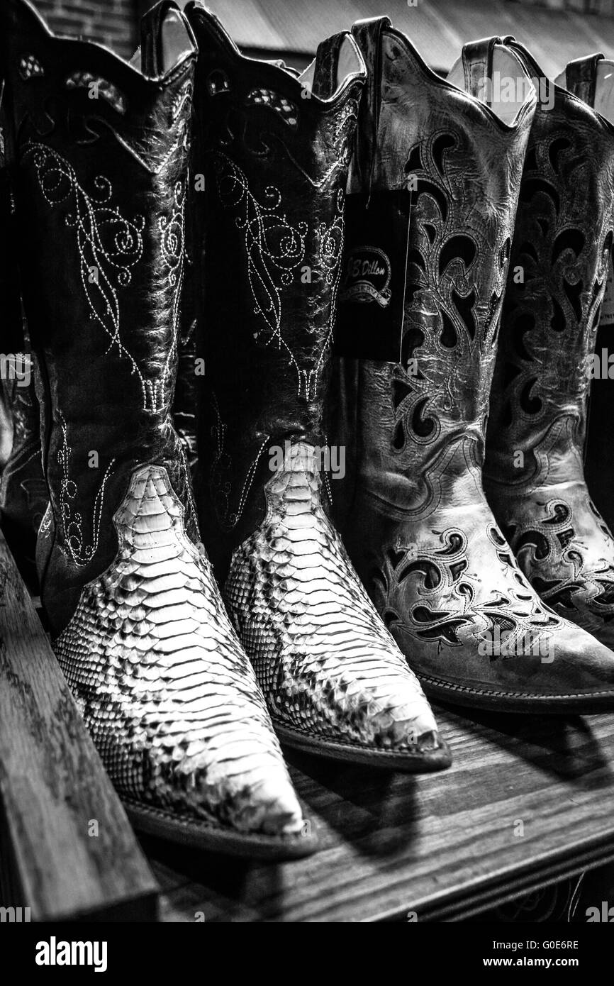 The Nashville Cowboy boot store has rows of unique Cowboy boots for sale in the downtown entertainment district in Nashville TN Stock Photo