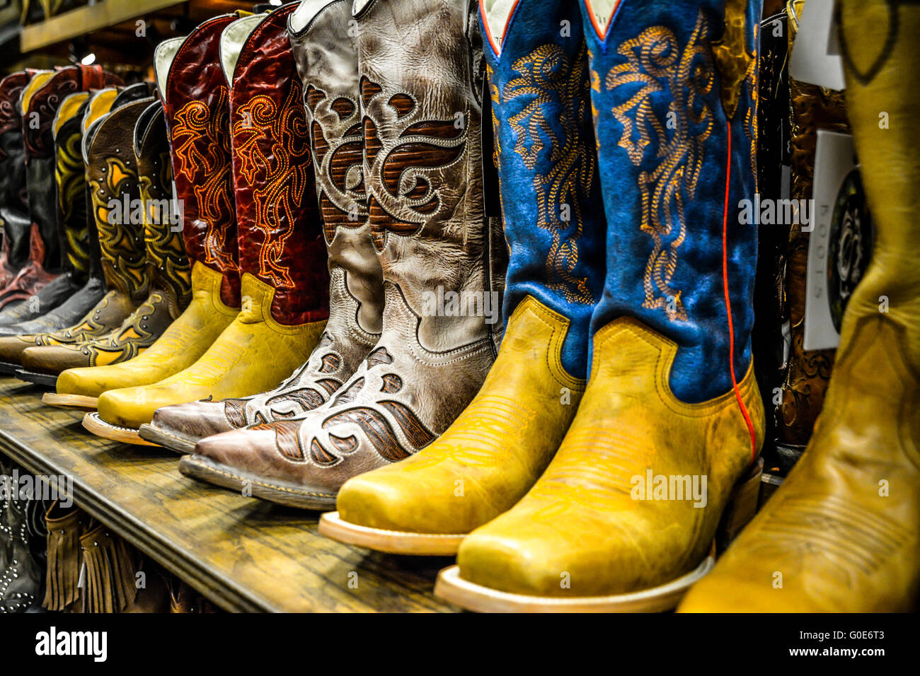 The Nashville Cowboy boot store has rows of unique Cowboy boots for sale in the downtown entertainment district in Nashville TN Stock Photo