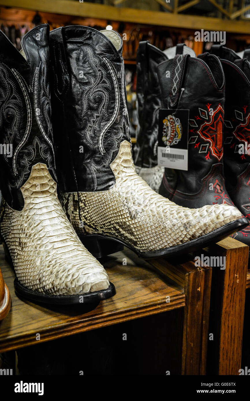 The Nashville Cowboy boot store has rows of unique Cowboy boots for sale in the downtown entertainment district in Nashville TN Stock Photo