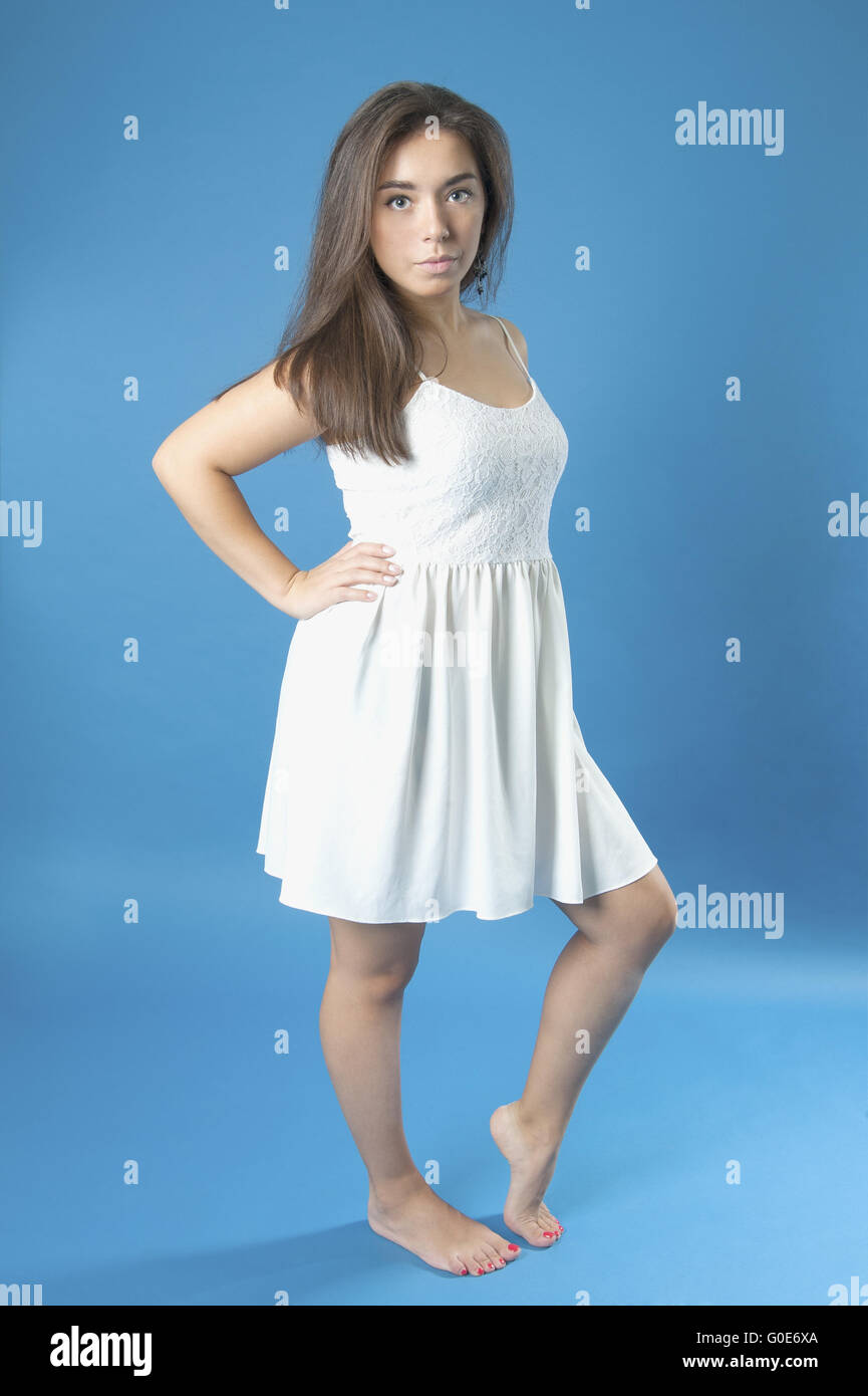 Young girl in a white dress with long hair Stock Photo - Alamy