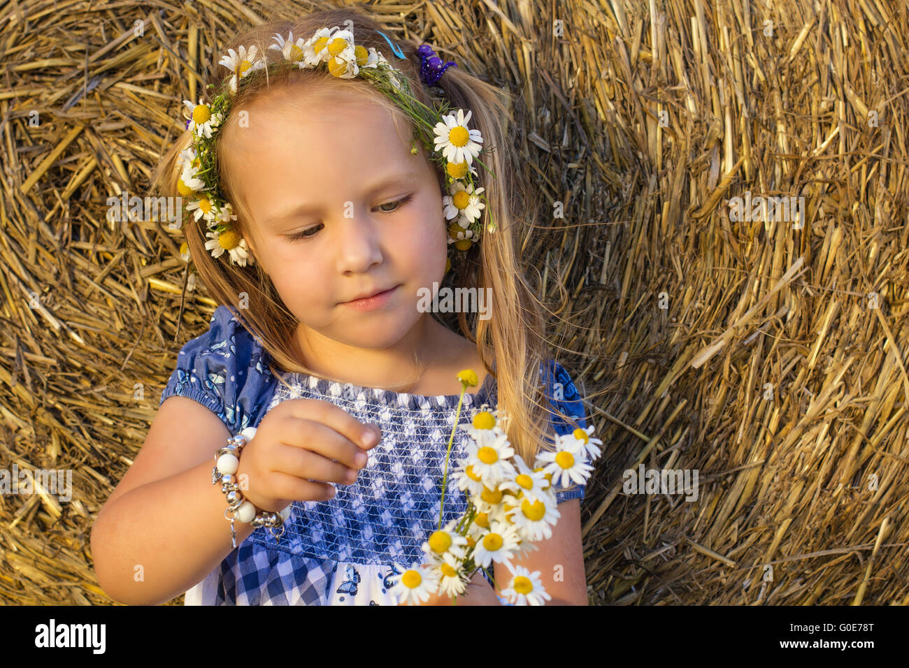 A girl playing He loves me not Stock Photo