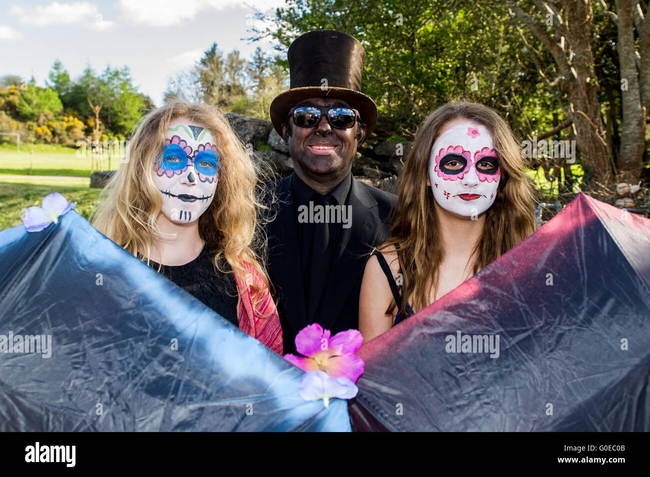Ballydehob, Ireland. 30th April 2016. Dressed up and faces painted for the Ballydehob Jazz Festival 'Day of the Dead' themed New Orleans Style Jazz Funeral were Keira Sievert; Pall Bearer Dominic Murray and Domino Roe, all from Ballydehob. Credit: Andy Gibson/Alamy Live News Stock Photo