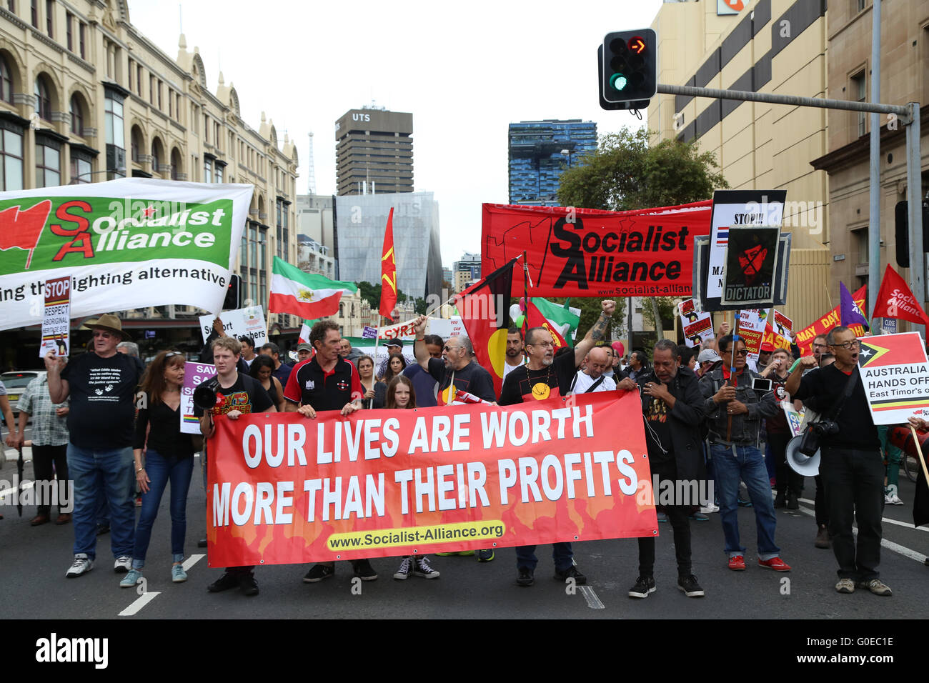 Sydney, Australia. 1 May 2016. The annual May Day March started in Belmore Park, near Central Station and proceeded along Broadway to Victoria Park, Camperdown. Various worker’s unions and other left wing organisations and groups took part. Pictured: Uncle Ken Canning and Socialist Alliance with a banner saying, ‘Our lives are worth more than their profits’. Credit:  Richard Milnes/Alamy Live News Stock Photo