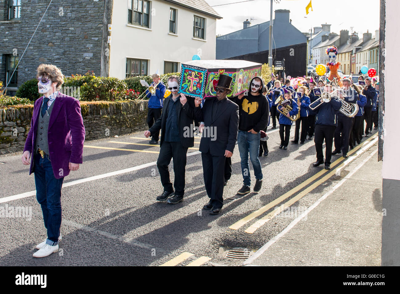 Ballydehob, Ireland. 30th April 2016. With Darragh Regan from Cork as the Funeral Director, the procession makes its way down Ballydehob Main Street during the Ballydehob Jazz Festival 'Day of the Dead' themed New Orleans Style Jazz Funeral. Credit: Andy Gibson/Alamy Live News Stock Photo