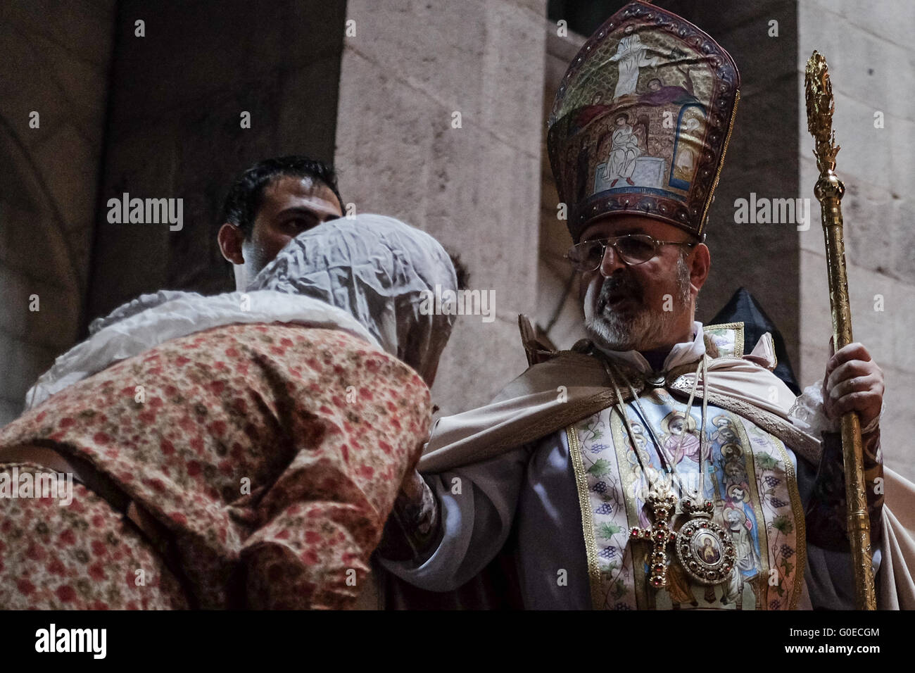 Jerusalem, Israel. 1st May, 2016. The Armenian Patriarch of Constantinople, also known as the Armenian Patriarch of Istanbul, Archbishop ARAM ATESHIAN, blesses faithful Eastern Orthodox Christians observing Easter Sunday at the Church of the Holy Sepulchre. Credit:  Nir Alon/Alamy Live News Stock Photo