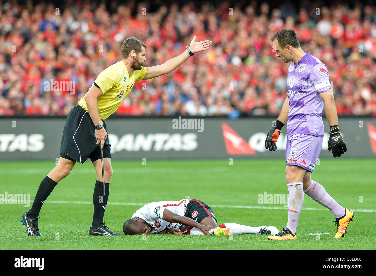 Adelaide Oval, Adelaide, Australia. 01st May, 2016. Hyundai A League Grand Final. Adelaide Versus Wanderers. Wanderers forward Romeo Castelen goes down under a heavy challenge as Adelaide captain Eugene Galekovic looks on. Adelaide won 3-1 © Action Plus Sports/Alamy Live News Stock Photo