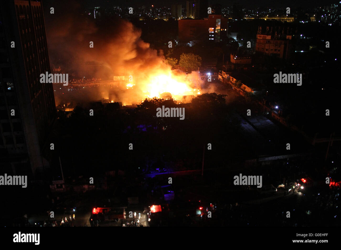 Dhaka, Bangladesh. 1st May, 2016. Fire has broken out at the largest kitchen Market at Karwan Bazar in Dhaka, Bangladesh on 1st May, 2016. Fire Service control room officials said, 22 units of fire fighting teams to bring the flames under control. There are about 200 shops in the area - where groceries and other kitchen goods are regularly distributed throughout Dhaka city after coming in from different parts of the country. Credit:  Rehman Asad/Alamy Live News Stock Photo