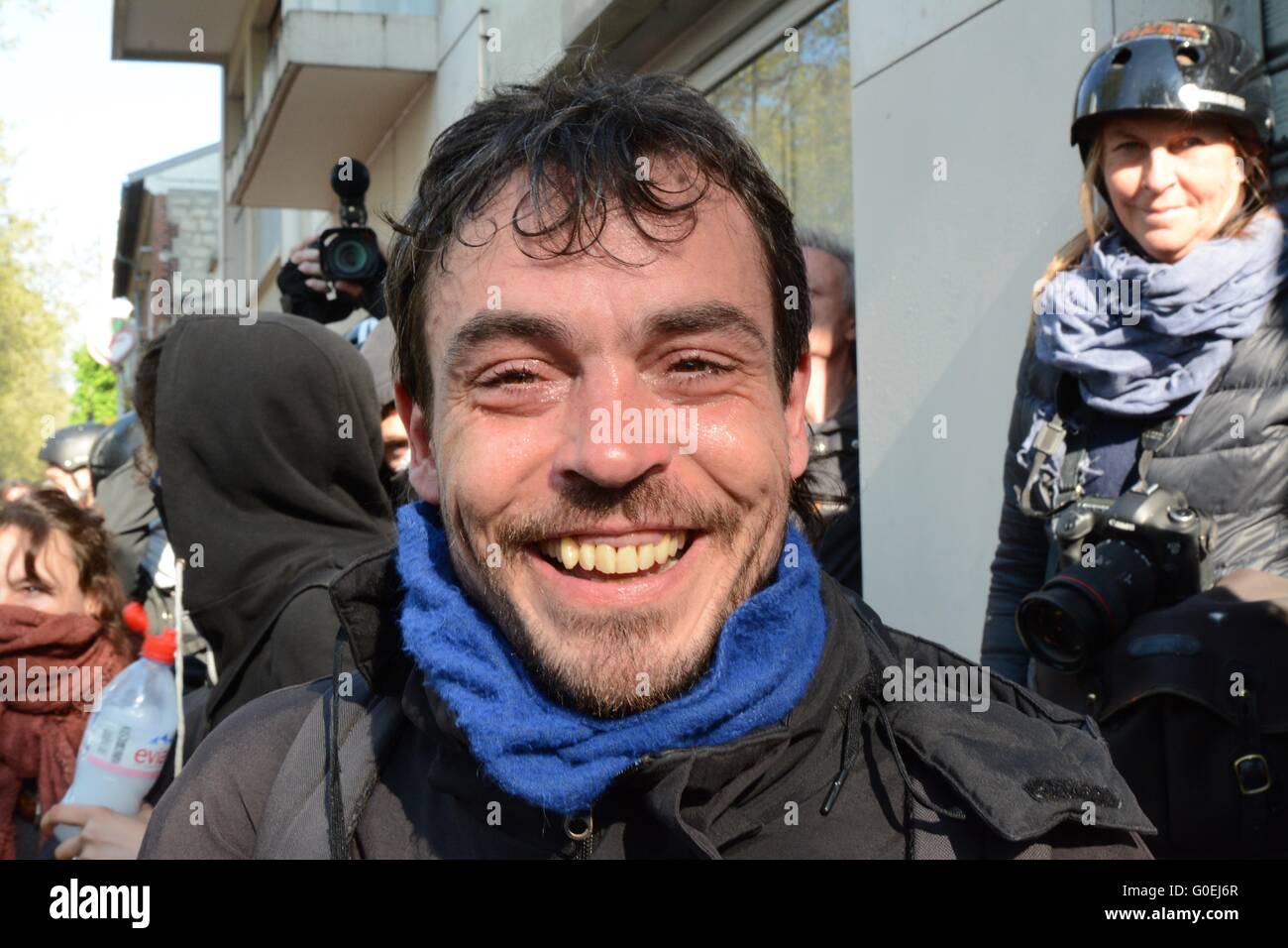 Paris, France. 1 May 2016. Protester smiles after being hit with teargas in Paris. Credit: Marc Ward/Alamy Live News Stock Photo