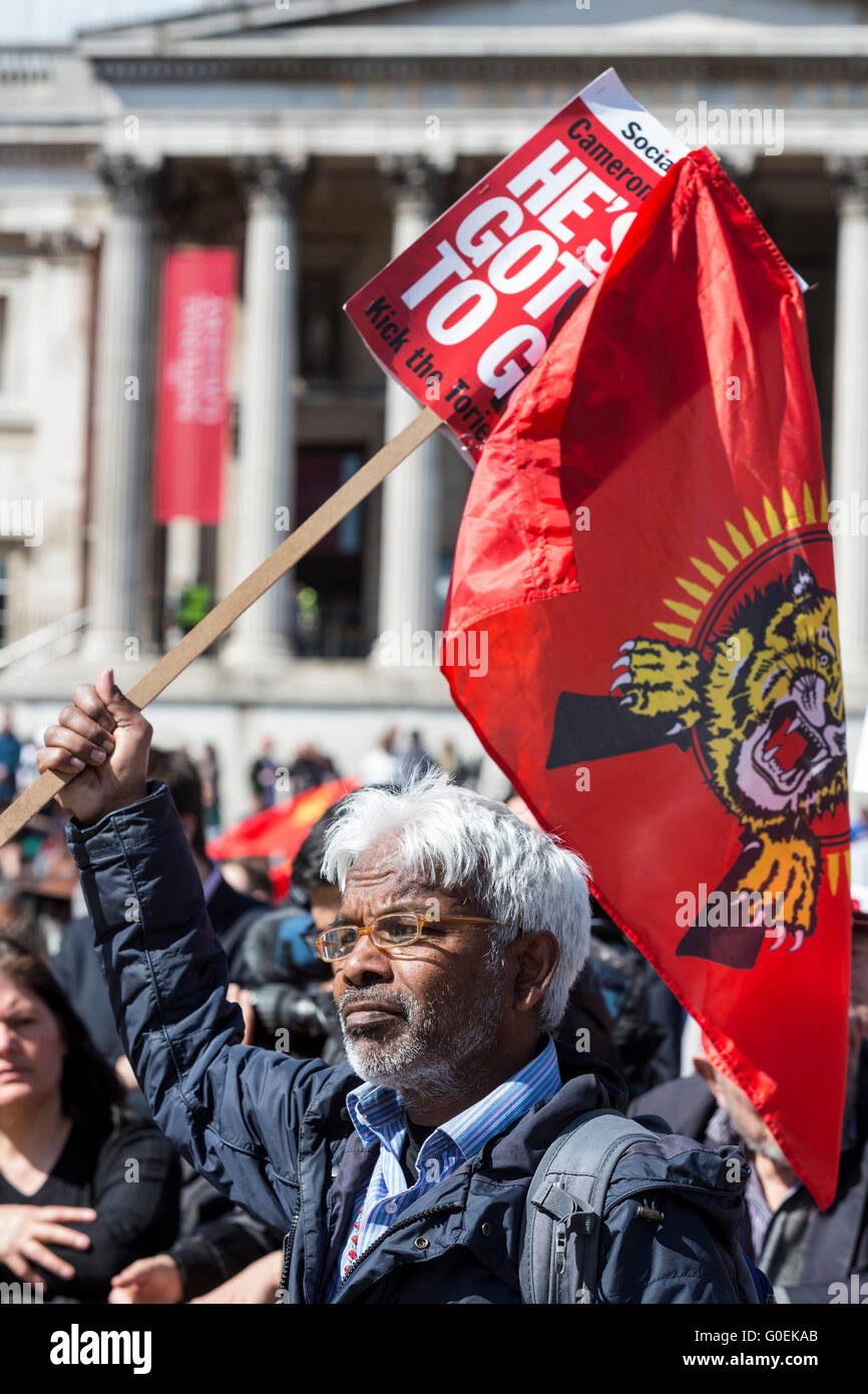 London, UK. 1 May 2016. Man with a Tamil Tigers flag in Trafalgar Square. May Day rally in London. Credit:  Vibrant Pictures/Alamy Live News Stock Photo