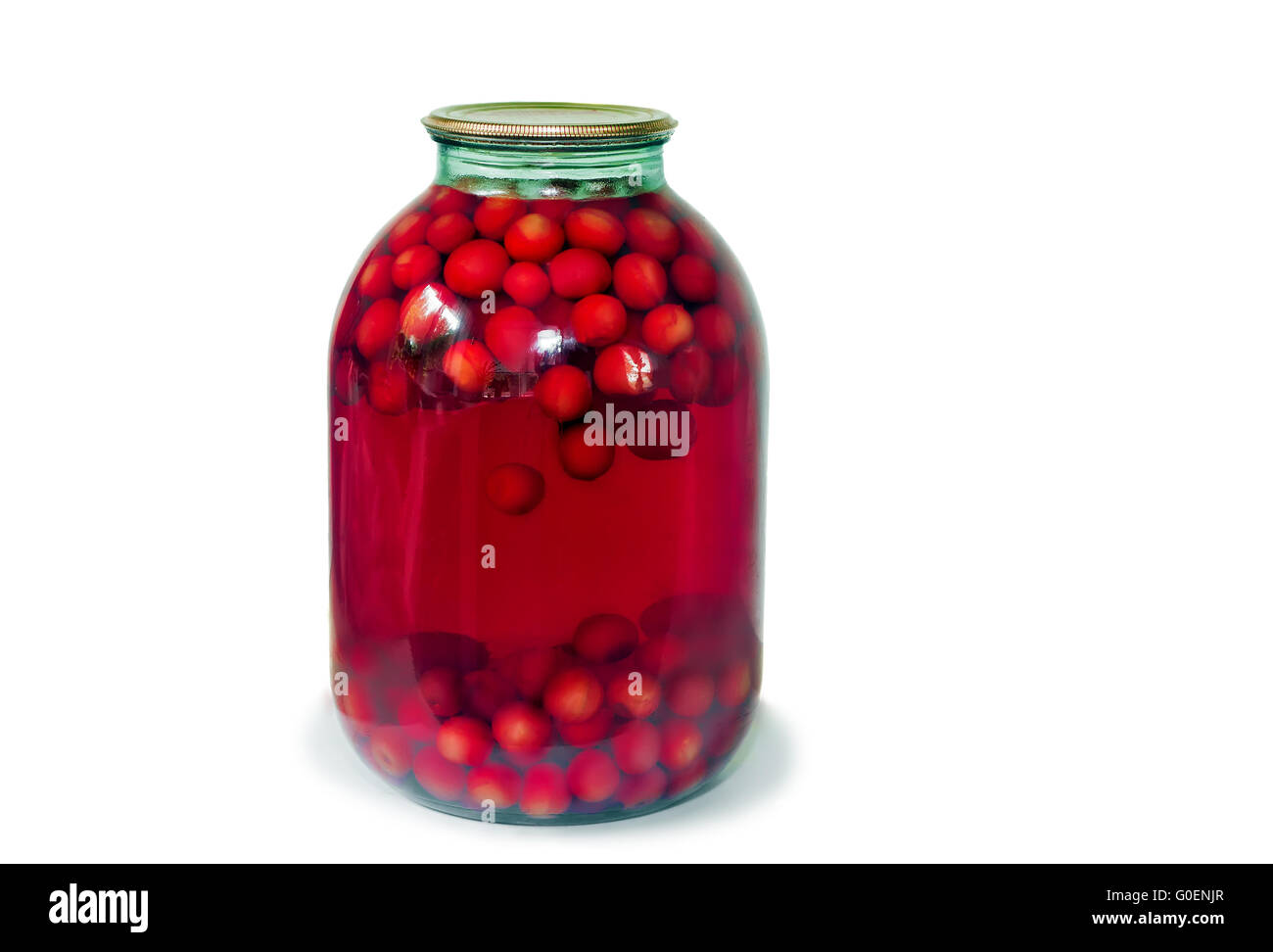 Home canning: glass cylinders with cherry compote Stock Photo