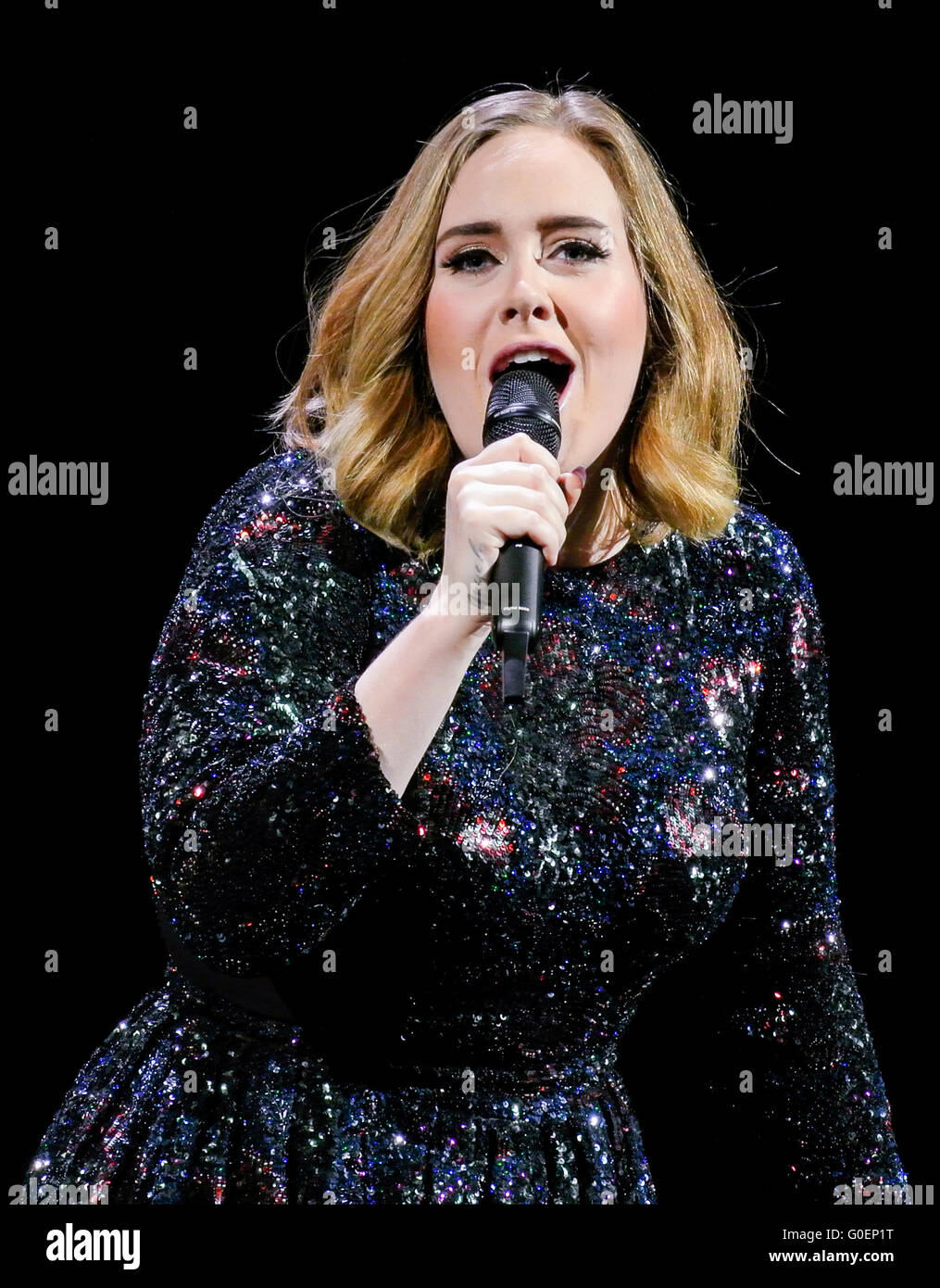 Adele wins an award whilst on stage in Birmingham as she wraps her UK tour. Adele was presented the iHeartRadio music awards gong for best song and gave an acceptance speech mid concert at the Genting Arena in Birmingham as she wraps her UK Tour this week.  Featuring: Adele Adkins Where: Birmingham, United Kingdom When: 30 Mar 2016 Stock Photo