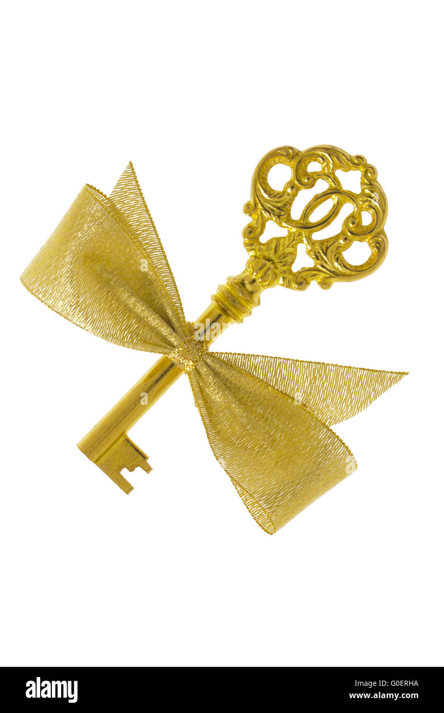 isolated golden key  decorated with ribbon Stock Photo