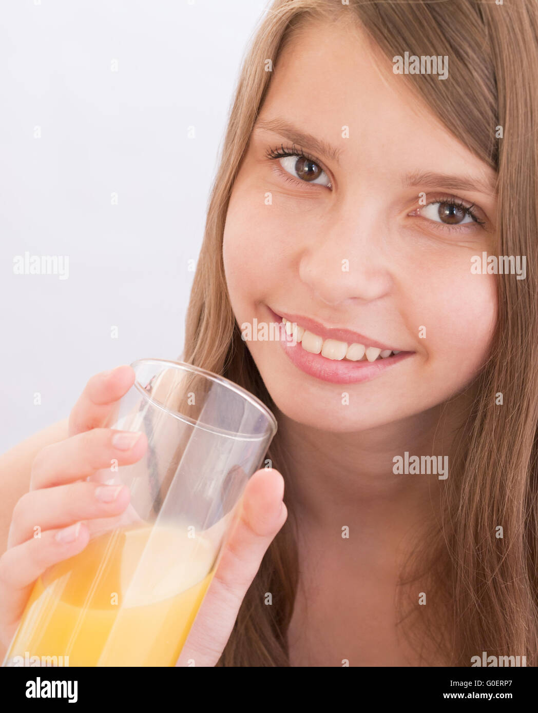 Teenage girls drinking orange juice Stock Photo Alamy