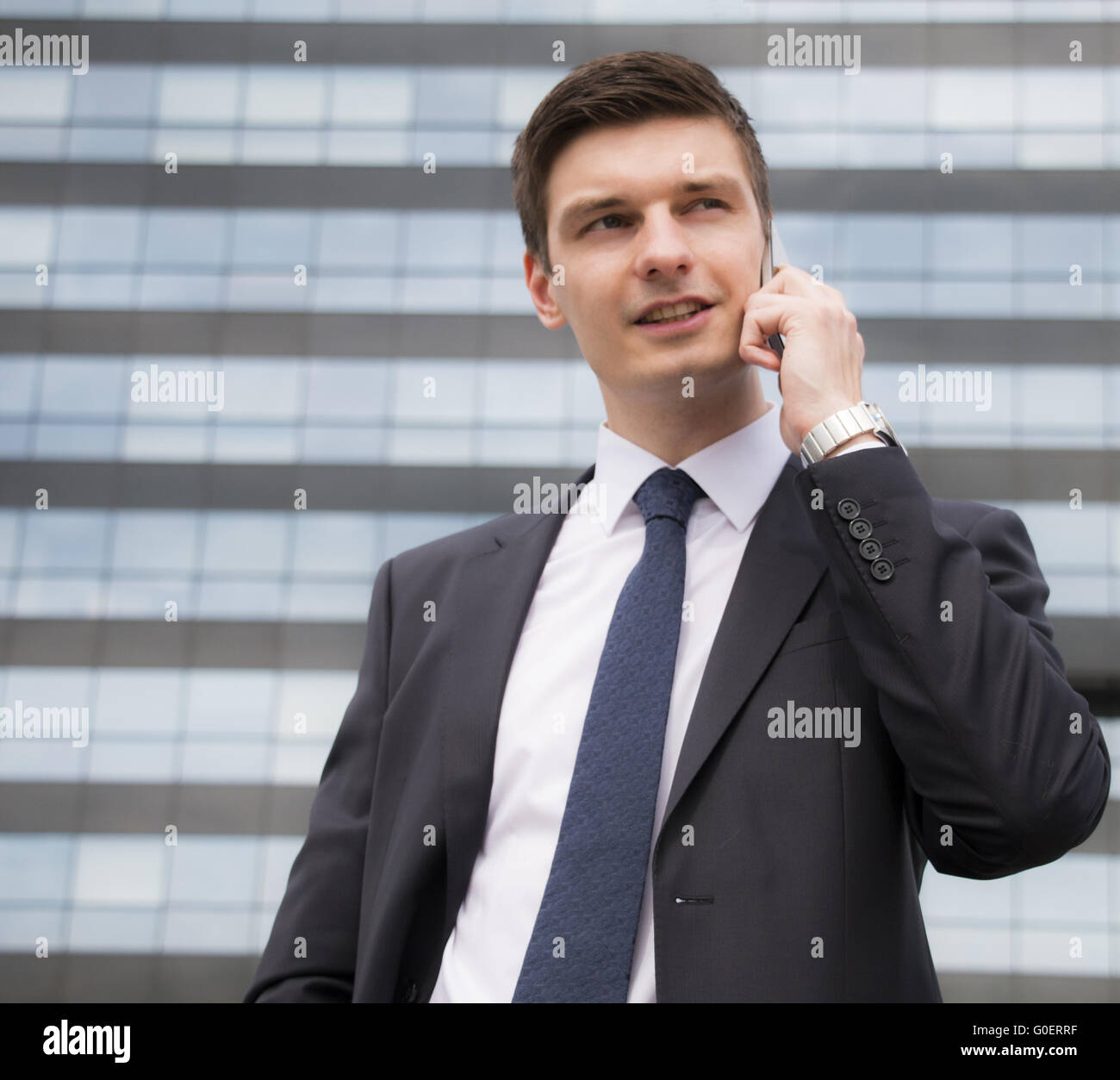 Young businessman in an urban setting Stock Photo