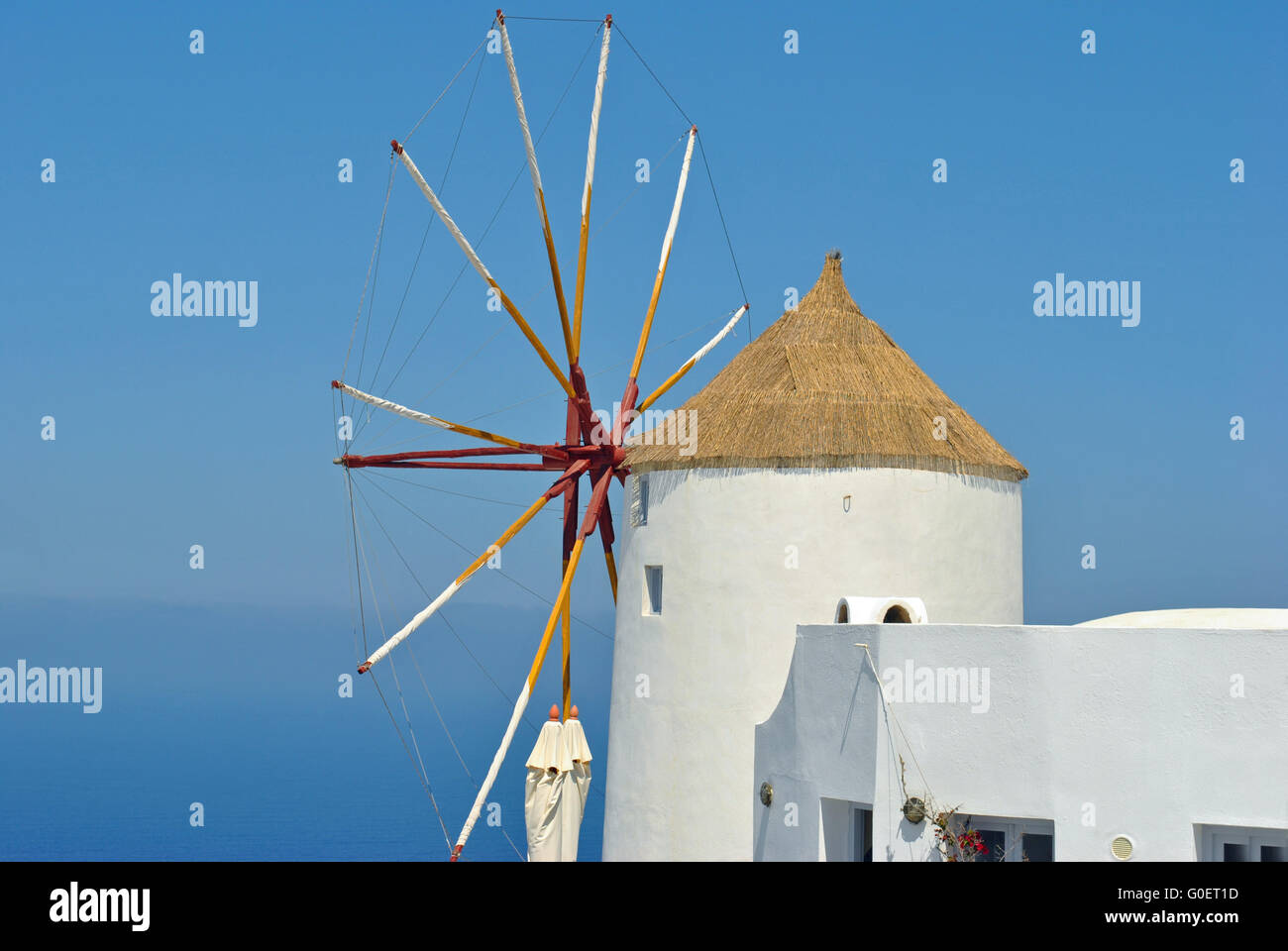 white windmill in oia on santorini island in greec Stock Photo